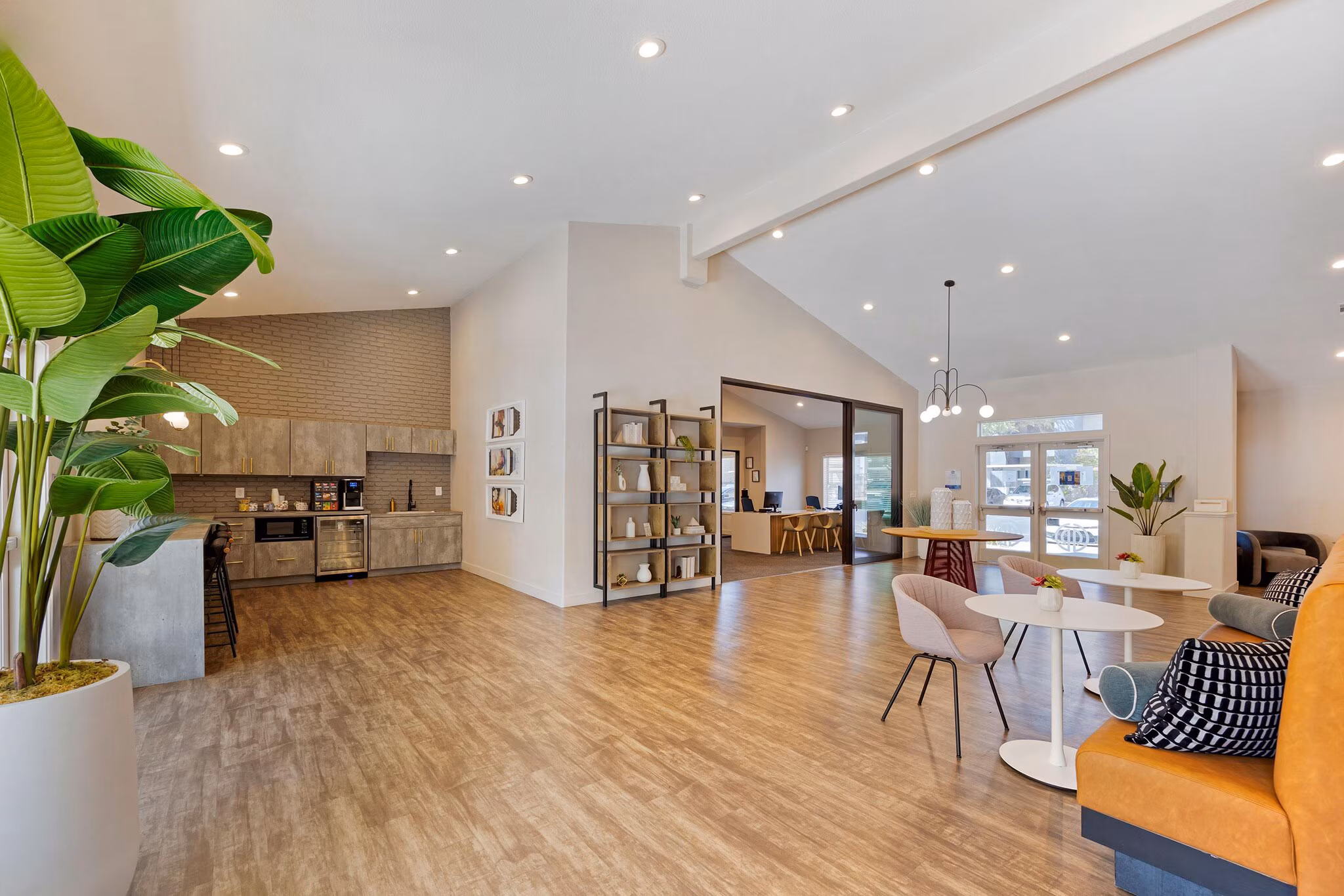 Renovated multifamily clubhouse and resident lounge with open layout and modern interior finishes