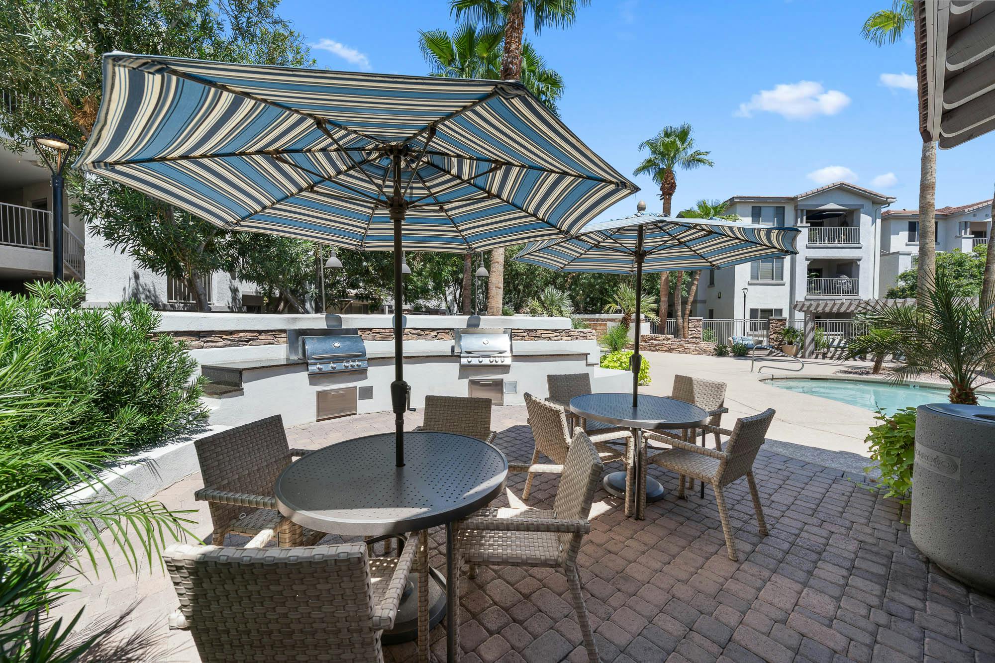 Resort-style apartment outdoor seating and poolside lounge area in Gilbert, AZ