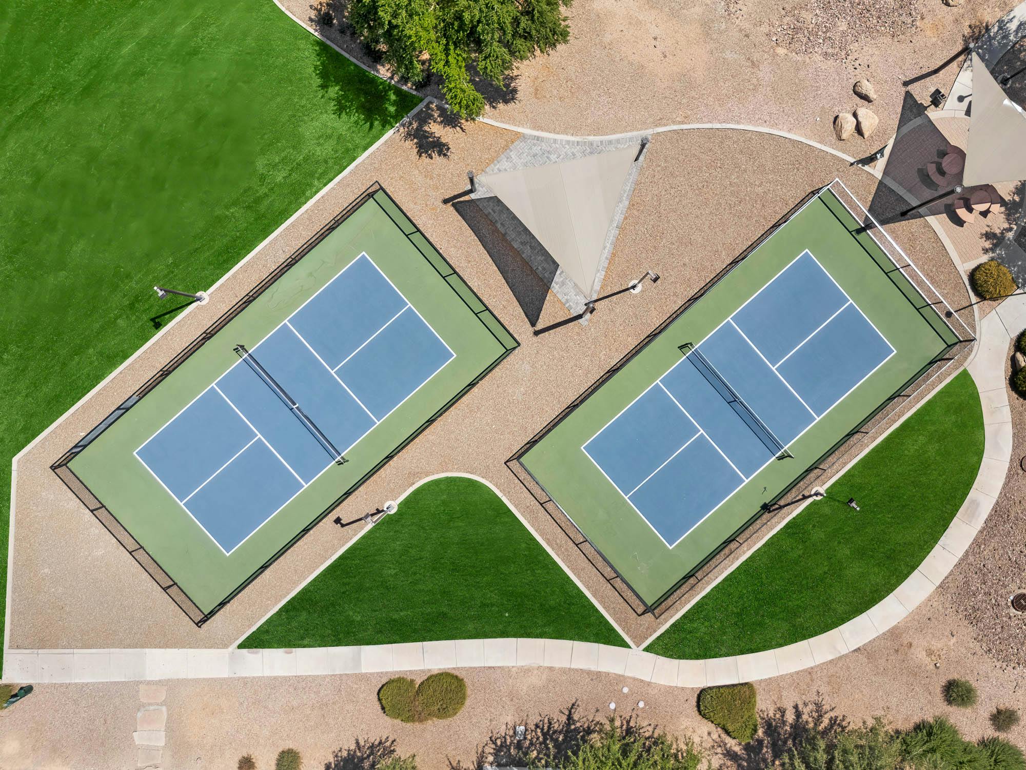 Aerial view of renovated multifamily tennis courts and recreation amenities in Gilbert, AZ