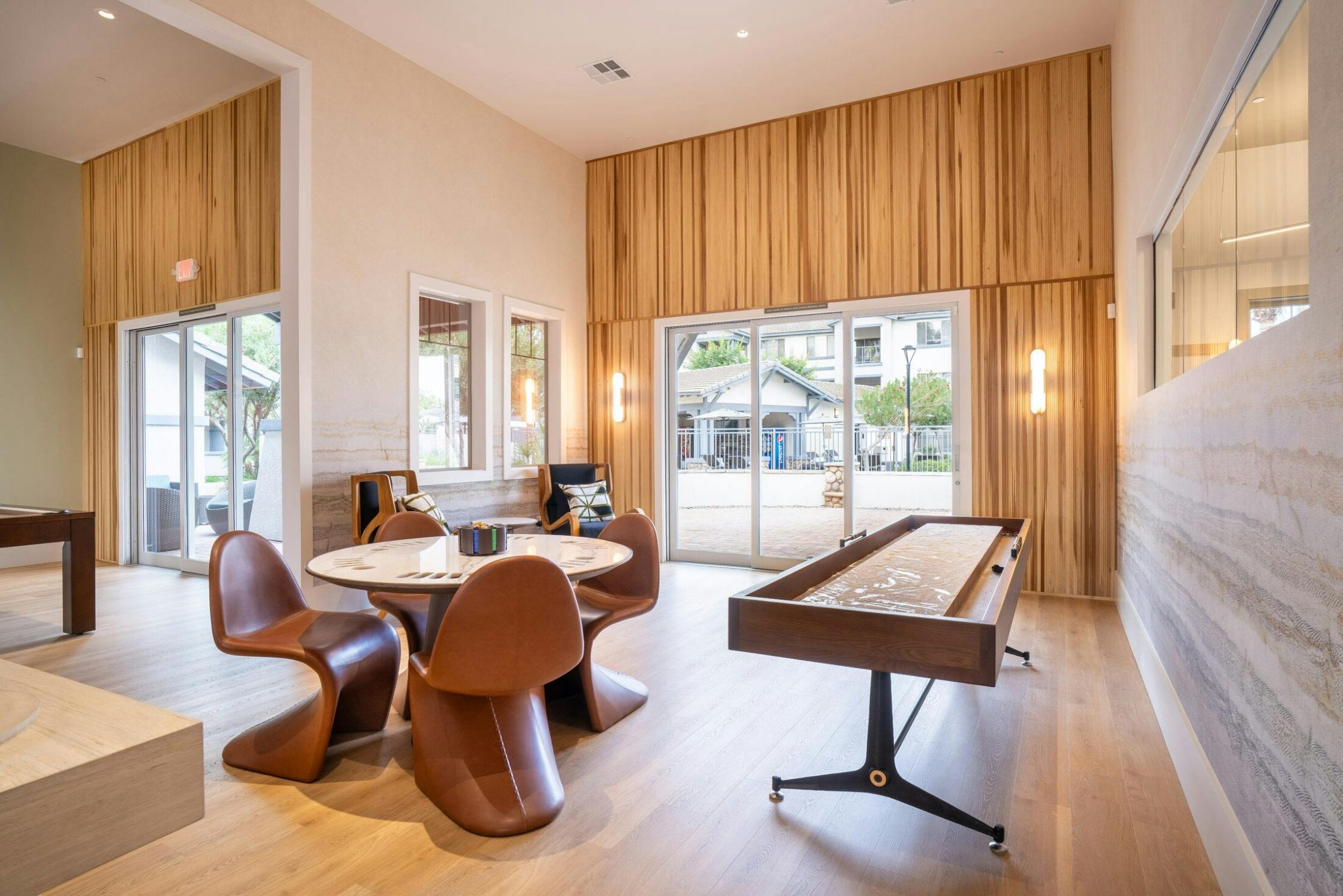 Multifamily resident entertainment lounge with pool table and luxury interior design in Gilbert, AZ