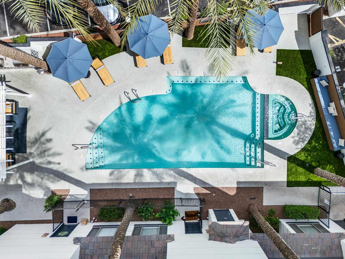 Aerial view of resort-style apartment swimming pool and outdoor amenities in Phoenix, AZ