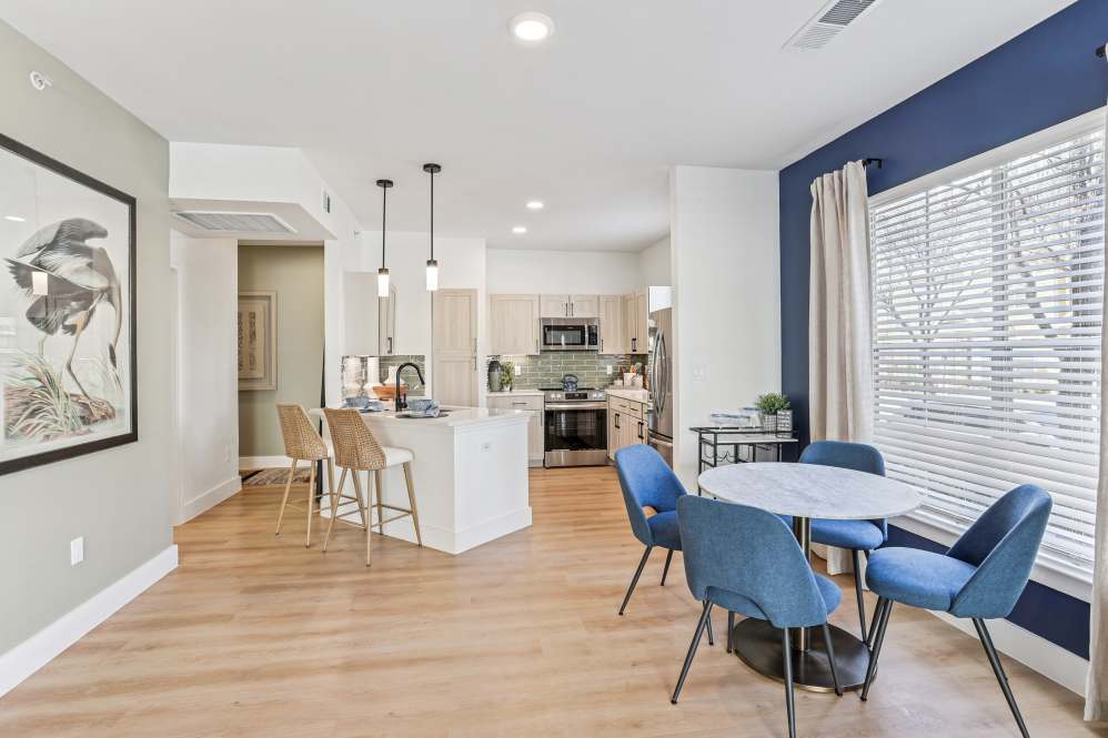 Upgraded apartment dining and kitchen area at Flatiron District at Austin Ranch